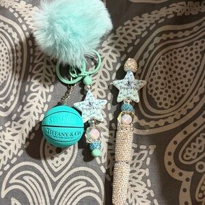 Teal and silver keychain and rhinestone pen set.  Includes extra gold en refill.